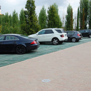 Heavy-duty grass protection mesh installed along a drainage channel edge at a commercial site
