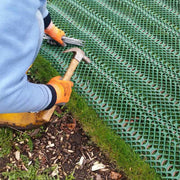 Wide view of a reinforced grass access road installed with Tenax GP-Flex 1800 heavy duty mesh
