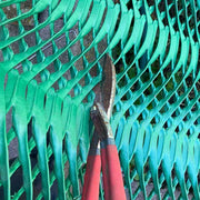 Shears used to cut Mudstop grass protection mesh during installation
