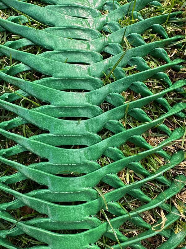 Close-up detail of the diamond weave pattern in Mudstop grass protection mesh
