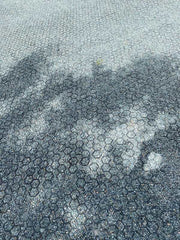 Close-up of NDS gravel paver grid cells filled with compacted crushed stone
